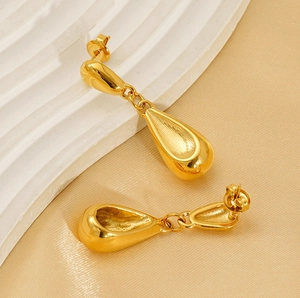 Detailed view of hollow gold-plated waterdrop earrings with a polished finish and elegant texture
