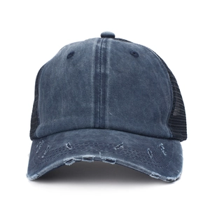 Detail of distressed brim and mesh back on a vintage washed cotton trucker baseball cap