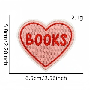 Detail view of heart embroidered book patch with pink center and size measurements