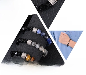 Close-up of 10mm faceted tiger eye and obsidian beads with silver metal charms
