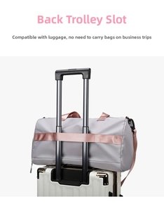Travel fitness bag detail showing the convenient back sleeve for luggage handle attachment
