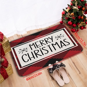 Détail d'un paillasson de Noël 40x60cm avec bordure à carreaux rouges sur sol en bois
