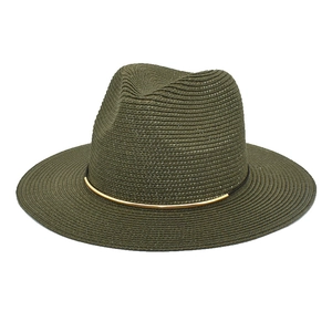 Detail of olive green woven fedora hat featuring black band and gold metal accent