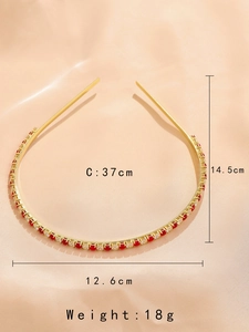 Detail showing dimensions of slim gold headband with red and white rhinestones