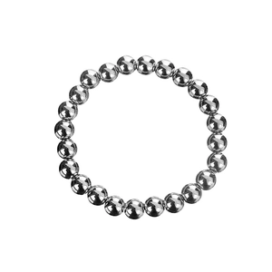 Macro shot of silver stainless steel beads showing polished finish and reflective texture