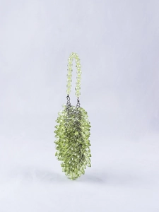 Detail of light green multifaceted crystal beads on a handmade beaded handbag