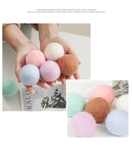 Close-up of colorful felt wool balls for Christmas DIY decor in macaron colors