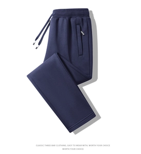 Detail of navy knit joggers showing elastic drawstring waistband and woven label