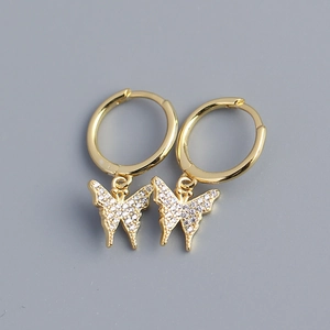 Detail of gold butterfly drop earrings with shimmering micro-pave crystals