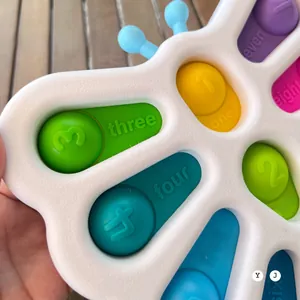 Macro shot of colorful silicone buttons with numbers 1-8 for infant sensory learning