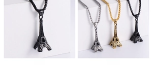 Macro detail of Eiffel Tower pendant necklace in black, gold, and silver finishes