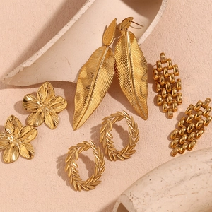 Detail view of 18K gold plated stainless steel floral and geometric earrings collection