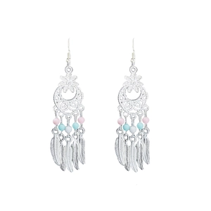 Bohemian dreamcatcher earrings with colorful beads and silver feather pendants on white background