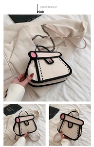 Detail of pink 2D cartoon style canvas bag showing black outlines and metal chain strap
