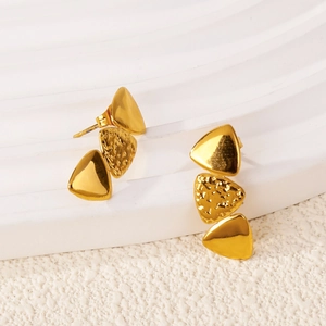 Detail of gold triple triangle earrings with hammered texture and smooth mirror finish
