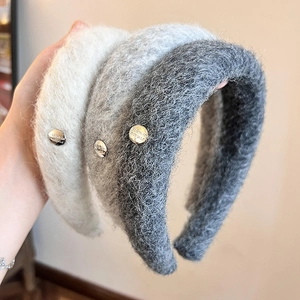 Three plush flocking headbands in white and grey with decorative silver metal buttons