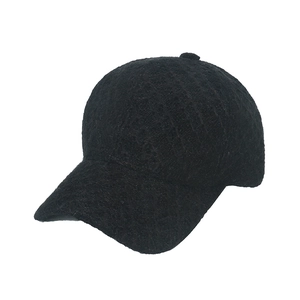 Close-up of black baseball cap featuring textured tweed fabric and solid color design