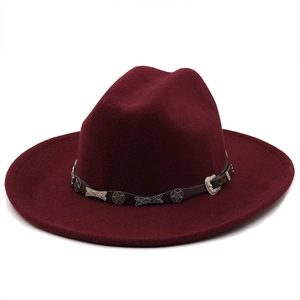 Detail of the deep wine red felt cowboy hat with leather band and metal star studs