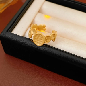 Detail of a gold adjustable ring with hammer texture finish in a jewelry box
