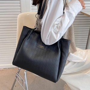 Black quilted leather tote bag with chain shoulder strap and Fashion Bags logo patch