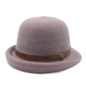 Elegant purple-grey knitted cloche hat with brown decorative band and metal emblem
