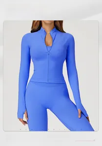 Close-up of sky blue ribbed seamless yoga jacket with thumbholes and zip-up collar