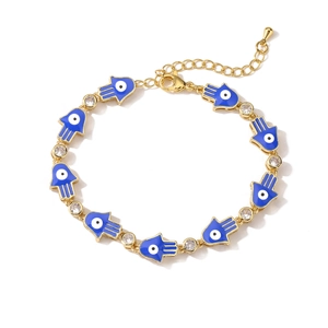 Golden Hamsa hand bracelet with blue enamel eye charms and sparkling rhinestones