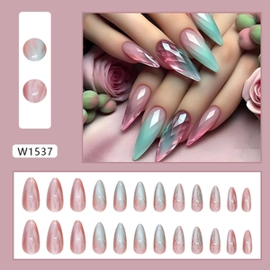Detail of pink and mint green gradient cat-eye press-on nails with 3D diamond cut texture