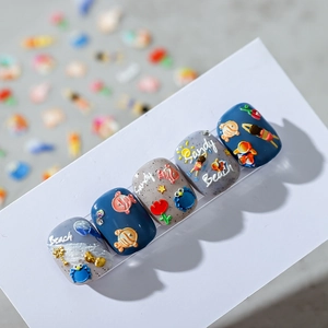 3D embossed ocean theme nail stickers with fish and floral designs in blue and grey