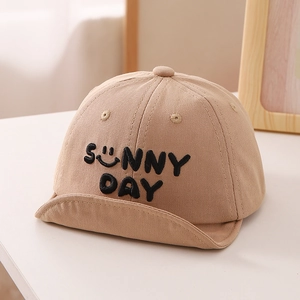 Detail of khaki baby sun hat featuring sunny day embroidery and soft brim design