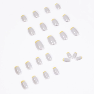 French tip press-on nails in light grey and yellow with a square-round shape