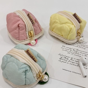 Quilted heart headphone pouch with pearl charm in pink, yellow and mint green colors