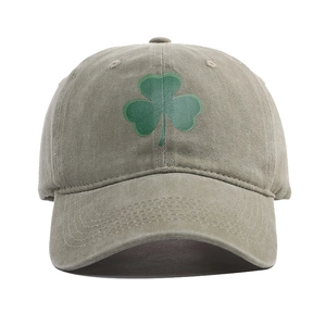 Vintage washed khaki cotton baseball cap with green shamrock embroidery on front view