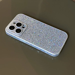 Detailed view of luxury silver phone case with sparkling rainbow rhinestones and lens protection