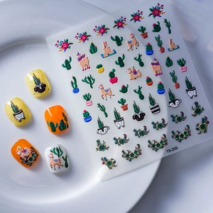 5D embossed nail stickers featuring cartoon alpaca and cactus designs on a white plate