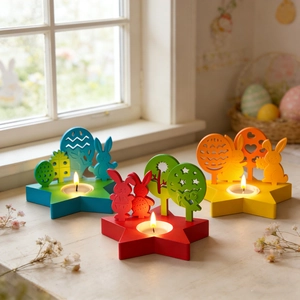 Close-up of Easter star candle holders with wooden bunny and egg cutout decorations