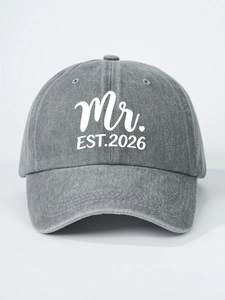 Detail view of washed grey cotton baseball cap with white Mr. EST.2026 embroidery
