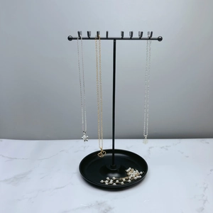 Black T-bar metal jewelry stand with necklace organizer hooks and tray base