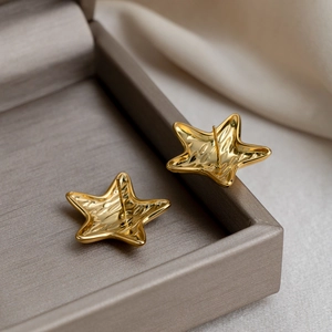 Polished 18K gold-plated stainless steel star stud earrings with unique lava texture surface