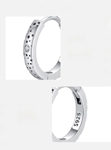 Macro detail of S925 sterling silver hoop earring with star motifs and D-color moissanite