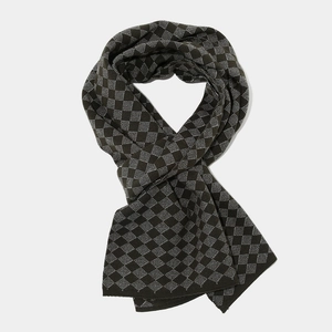 Detailed close-up of high-density knit scarf with classic rhombus checkered pattern