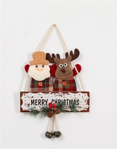 Detail of fabric Santa and reindeer hanger with Merry Christmas wooden sign and bells