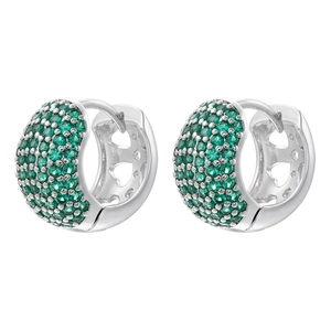 Macro view of silver-tone earrings with pavé green gemstones and heart cutouts