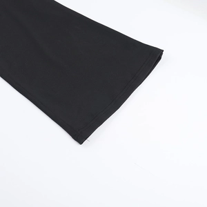 Detailed macro view of the black knit fabric with reinforced double stitching on cuffs
