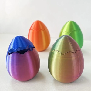 Set di quattro uova a sorpresa pasquali stampate in 3D in colori arcobaleno e tinta unita