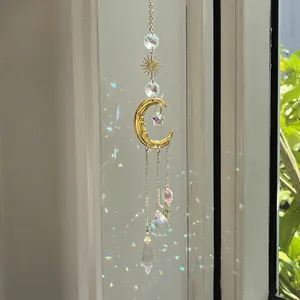 Celestial sun catcher with gold moon, star pendants and crystal prisms for garden decor