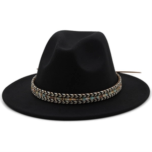 Close-up of black wool fedora featuring a colorful ethnic woven band and wide flat brim