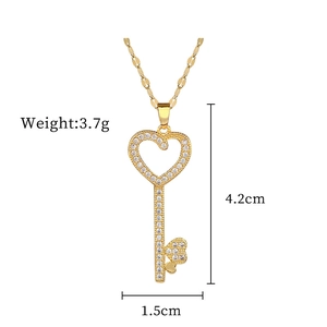 Detailed view of gold heart key necklace with dimensions 4.2cm by 1.5cm and 3.7g weight