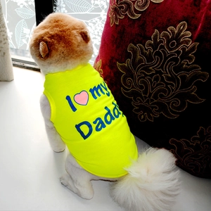 Detail of yellow dog vest with 'I Love my Daddy' print on elastic knitted fabric