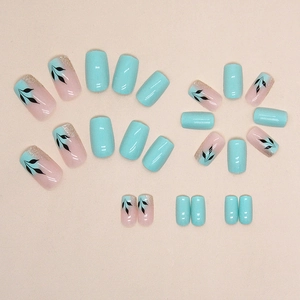 Long square green leaf nail art set with blue and pink press-on nails and gold glitter
